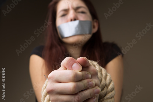 Brunette gagged and tied hands