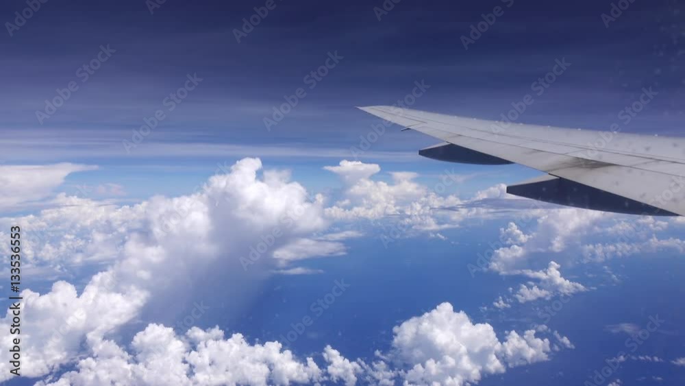 Breathtaking view through ice glazed aircraft window on blue sky, cloudscape and airplane wing. Traveling by air above beautiful clouds. 4k Ultra HD 3840x2160
Breathtaking view through ice glazed aircraft window on blue sky, cloudscape and airplane wing. Traveling by air above beautiful clouds. 4k Ultra HD 3840x2160