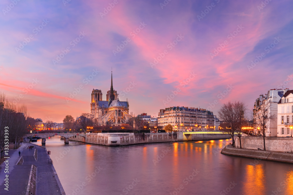 Picturesque grandiose sunset over Ile de la Cite, Seine River and Cathedral of Notre Dame de Paris, France