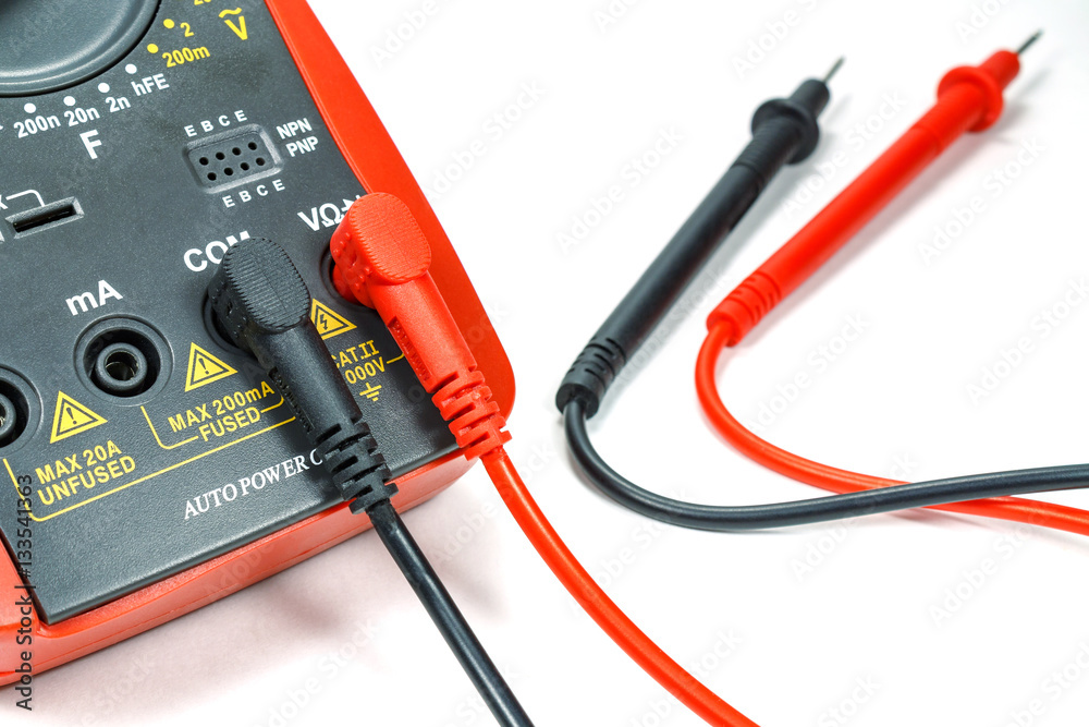 Digital multimeter with attached probes on a white background Digital multimeter with attached probes on a white background
