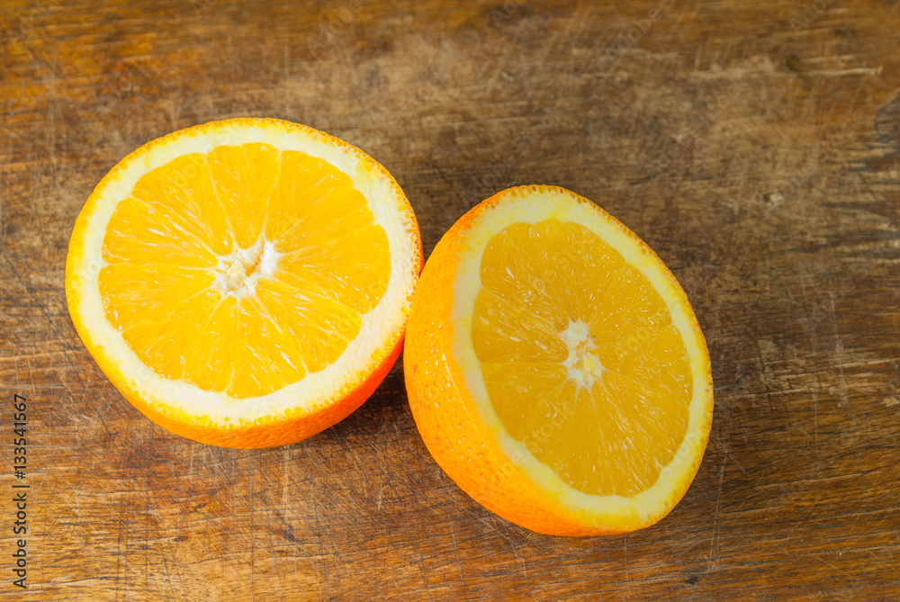 Oranges Fruits and Orange Slice on Wooden Table and Retro Fabric Oranges Fruits and Orange Slice on Wooden Table and Retro Fabric