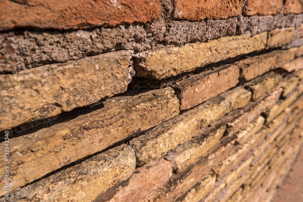 Ancient wall and sunlight. Cement and thin bricks. Touch the past. Ancient wall and sunlight. Cement and thin bricks. Touch the past.