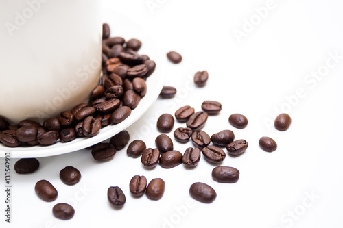 White coffee cup and coffee bean on white background.