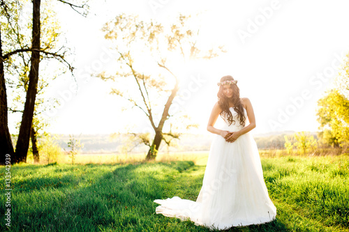 Wallpaper Mural Beautiful bride in wedding dress and with a lovely mood in nature Torontodigital.ca