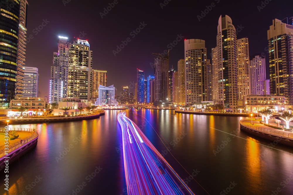 Busy promenade and the bay in Dubai Marina in the evening,Dubai,United Arab Emirates