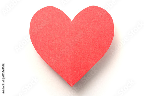 Red paper heart on white with shadow