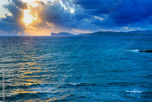 blue sea and yellow sky at sunset