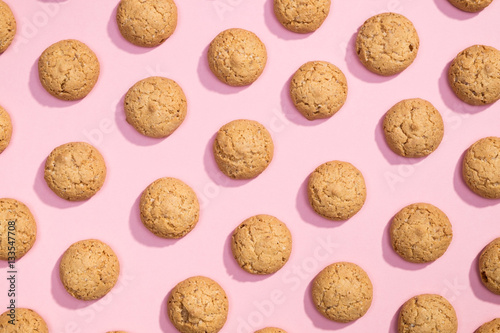 Pattern of sweet cookies on pink background