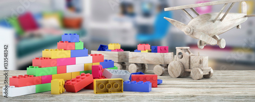 Plastic building blocks,plane and blur background photo