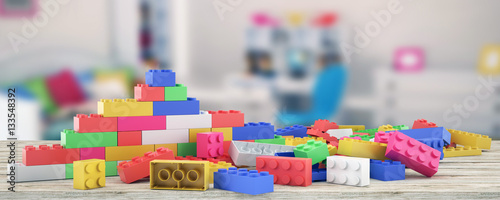 Plastic building blocks and blur background photo
