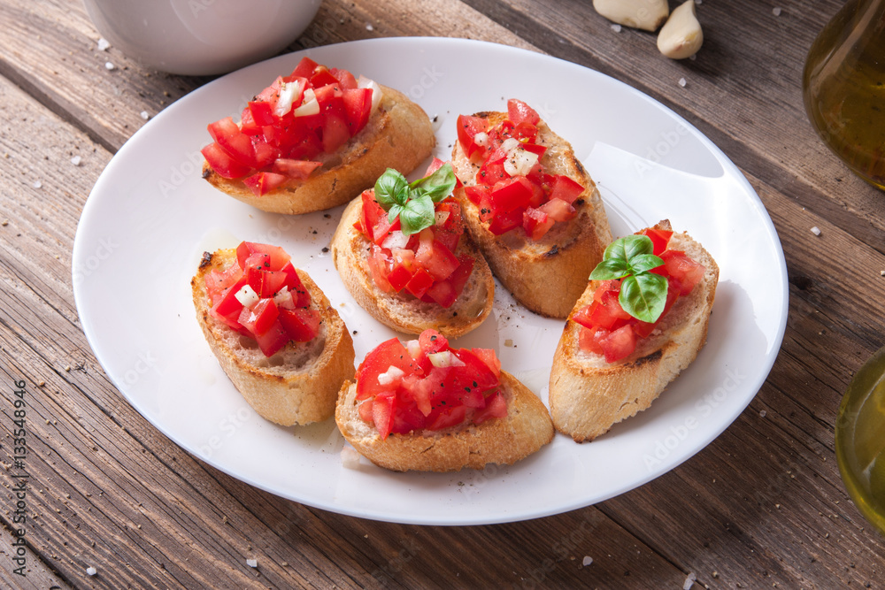 Bruschetta with tomato, onion and basil Bruschetta with tomato, onion and basil