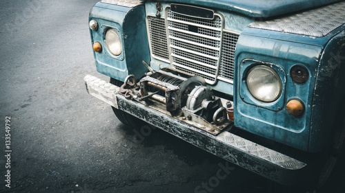 Detail of a old vintage off-road front stop on street.