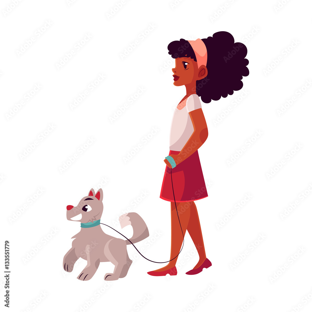 Black, African American girl walking with her white dog on a loose