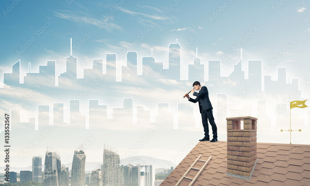 Engineer man standing on roof and looking in spyglass. Mixed med Engineer man standing on roof and looking in spyglass. Mixed med