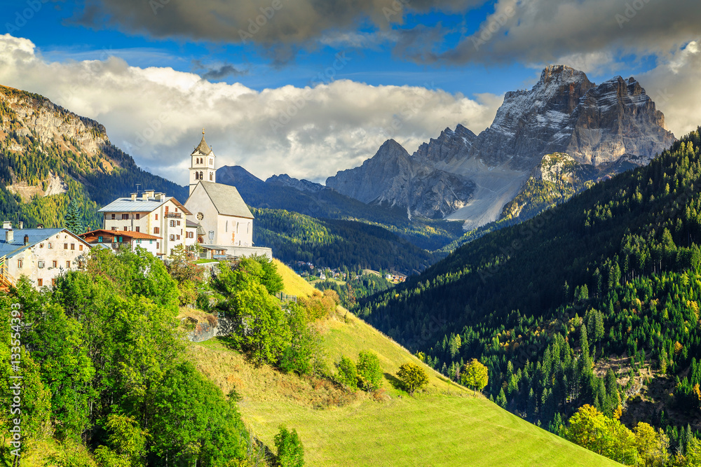 Amazing spring landscape with church on the hill, Dolomites, Italy