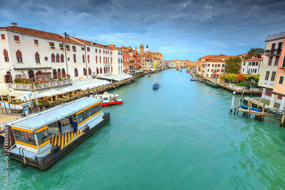 Fototapeta premium Spectacular canal with restaurant, hotels, boats in Venice, Italy, Europe