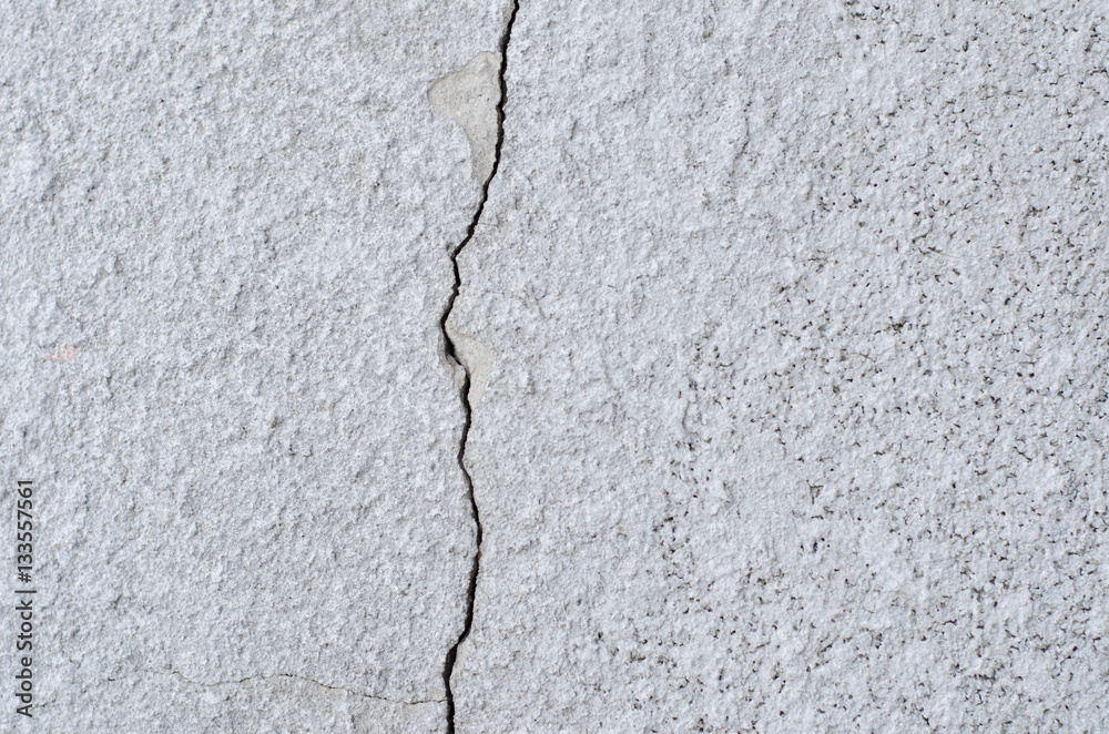 crack on the light wall texture close-up crack on the light wall texture close-up