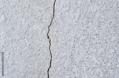 crack on the light wall texture close-up