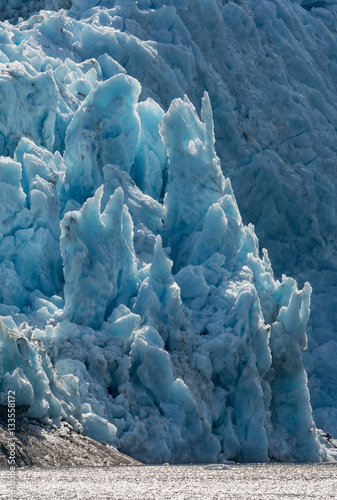 Crumbling blue ice of Blackstone Glacier photo