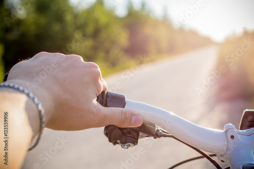 Cyclist riding a bicycle on a warm summer day  playing sports