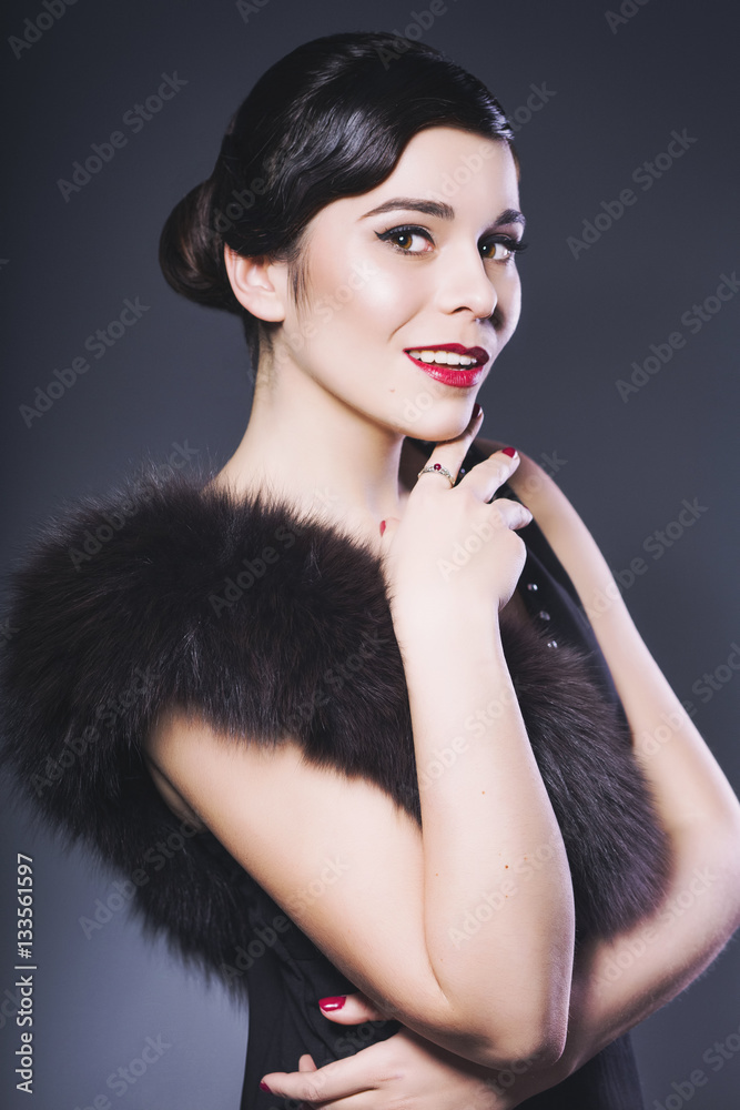 Beautiful Brunette Retro Woman with red lips make up and wave bang hairstyle Beautiful Brunette Retro Woman with red lips make up and wave bang hairstyle