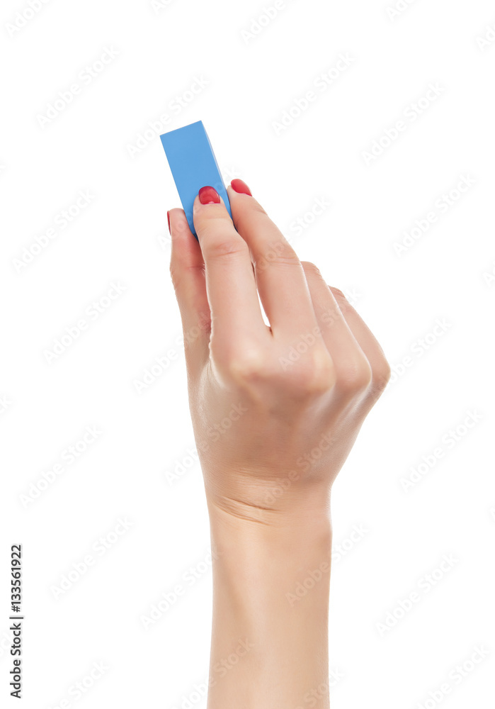 Female hand holds the eraser. Female hand holds the eraser.