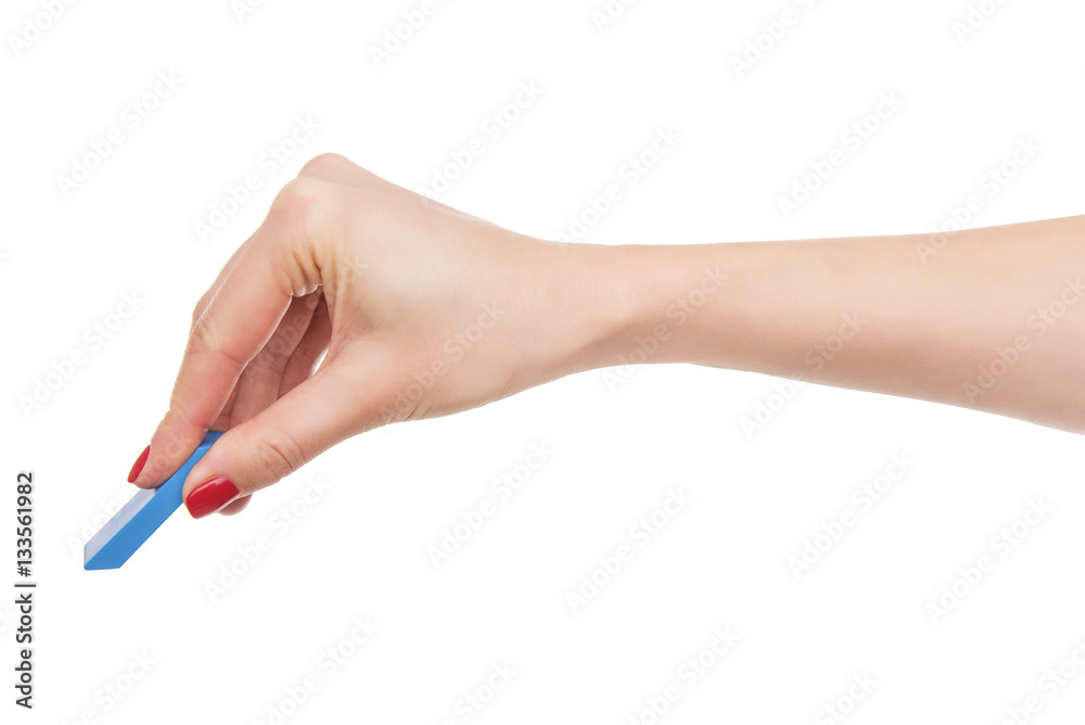 Female hand holds the eraser. Female hand holds the eraser.