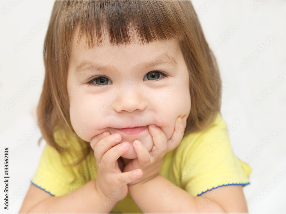 smiling happy little girl portrait with cute cheeks isolated on white background, happy childhood concept smiling happy little girl portrait with cute cheeks isolated on white background, happy childhood concept