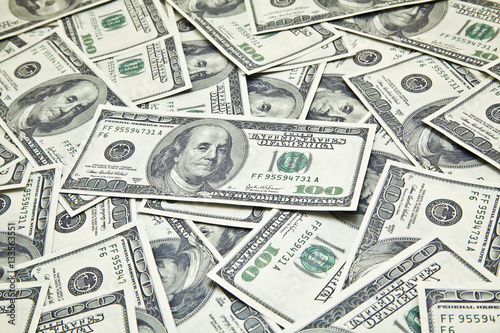 Scattered 100 Dollar bills