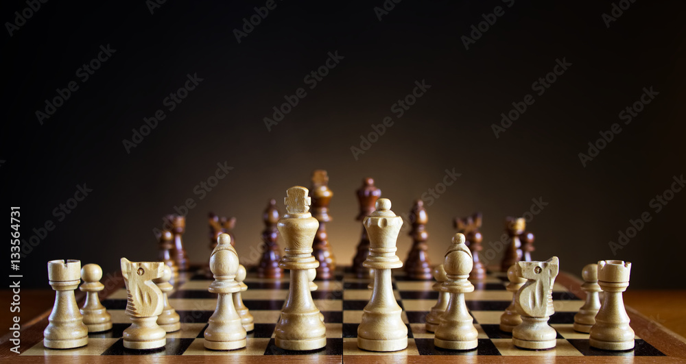 Chess board with figures in white background, Stock image