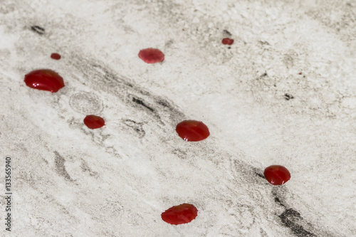 red blood droplets on table