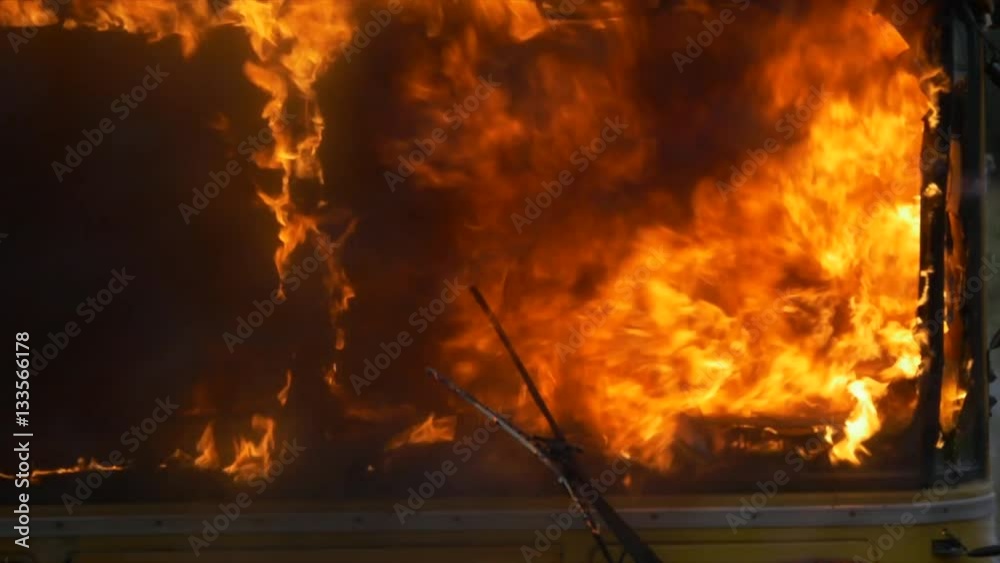 School bus on fire- front windows smashed School bus on fire- front windows smashed