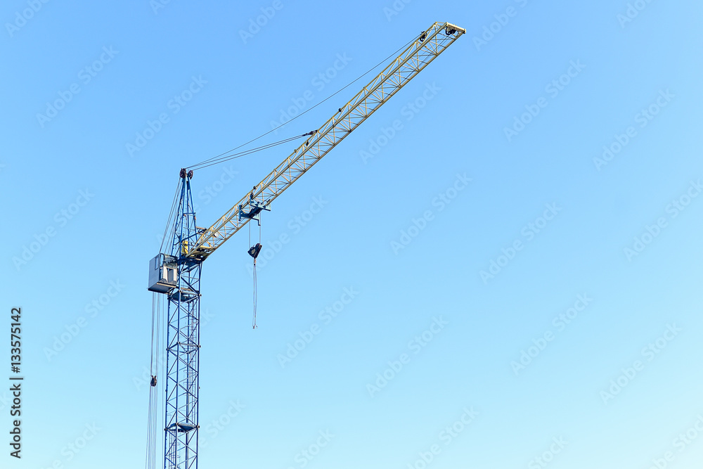 building crane against the blue sky building crane against the blue sky