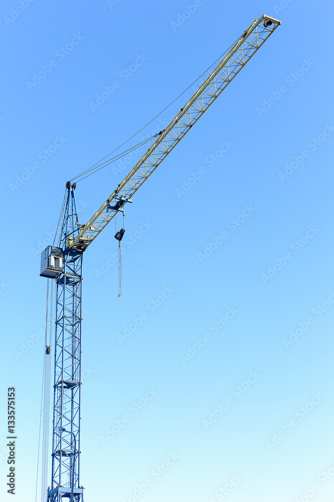 building crane against the blue sky