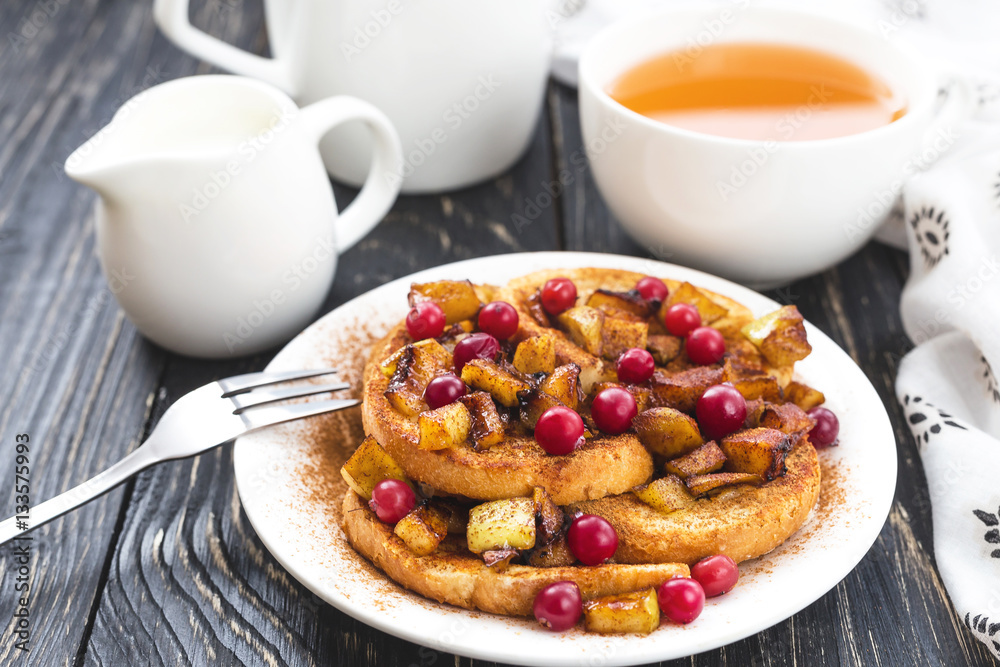 Hot french toasts with caramelized apples, and tea Hot french toasts with caramelized apples, and tea