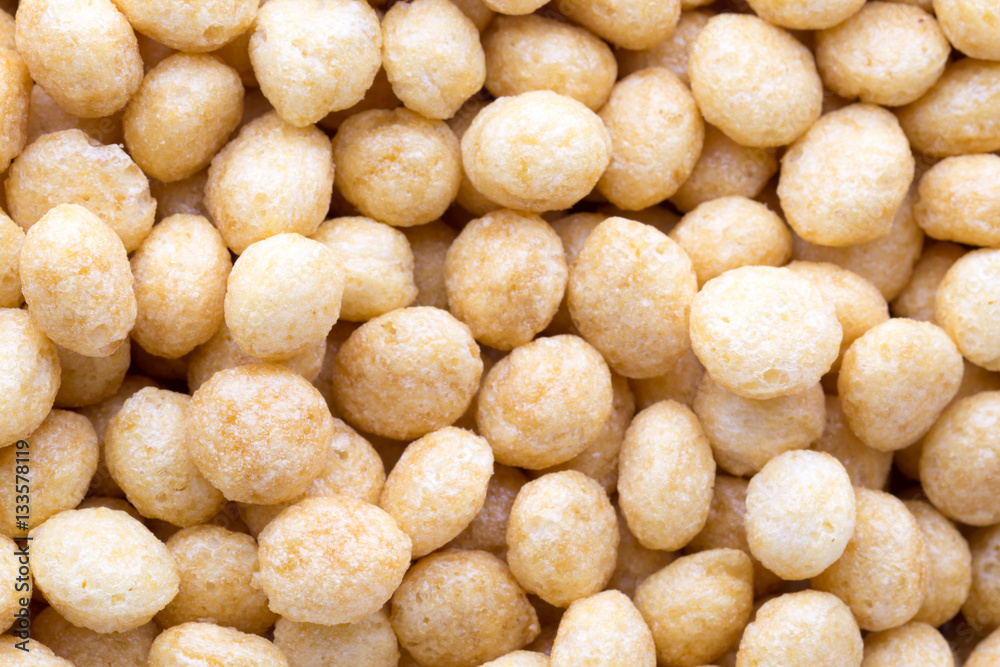 Corn flakes rings on the background. Corn flakes rings on the background.
