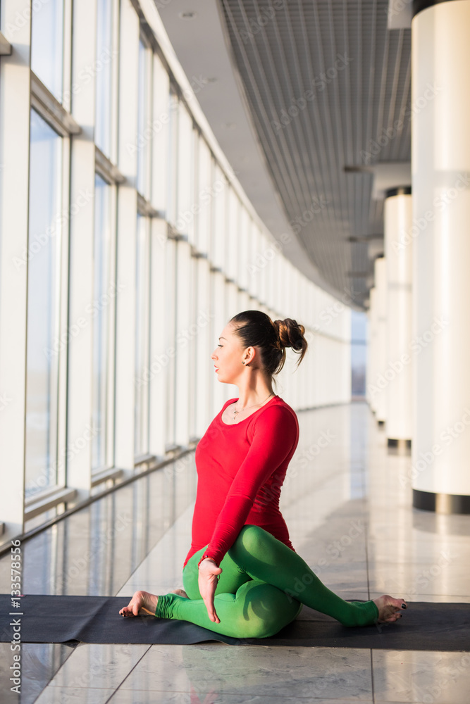 Beautiful yoga woman practice in a big window hall background. Yoga concept. Beautiful yoga woman practice in a big window hall background. Yoga concept.