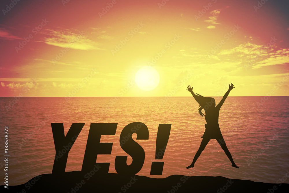 Silhouette young woman jumping and raising up her hand about happy concept on YES text over a beautiful sunset or sunrise at the sea. background for happy news years. success in 2017 years Silhouette young woman jumping and raising up her hand about happy concept on YES text over a beautiful sunset or sunrise at the sea. background for happy news years. success in 2017 years
