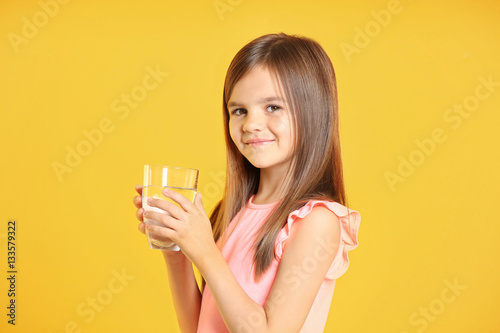 Attractive little girl hold...