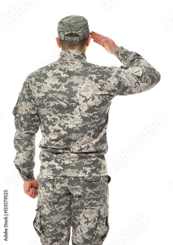 Fotografía Saluting soldier in camouflage on white background