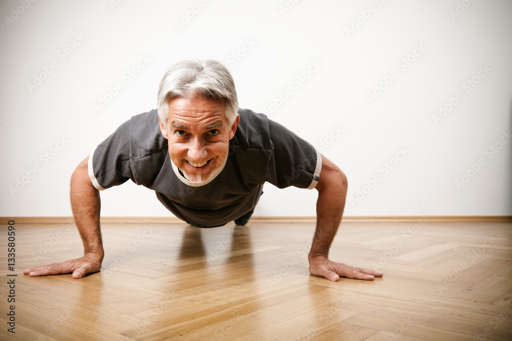 Fototapeta premium Man In His 50s Doing Pushups