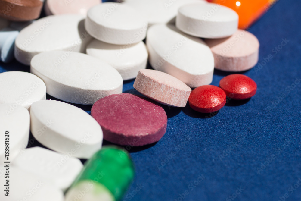 Multiple pills depicting medical treatment or pahrmaceutical ind Multiple pills depicting medical treatment or pahrmaceutical ind