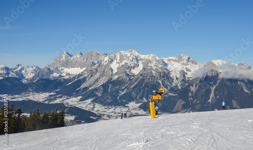 Beautiful view of the snow-covered mountains and ski slope in winter © kobolia