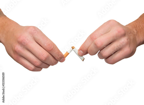 Broken cigarette in his hand. Isolated on white.