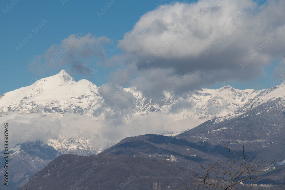 Snowy mountain massif in Val di Susa. Piedmont. Italy