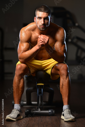 Man Rests In Gym After Having A Workout