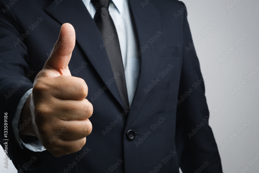Business man with thumb up hand sign Business man with thumb up hand sign