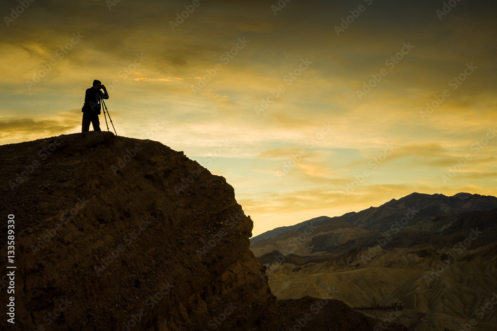 Photographer at Zabriskie Point before sunrise, Death Valley, CA