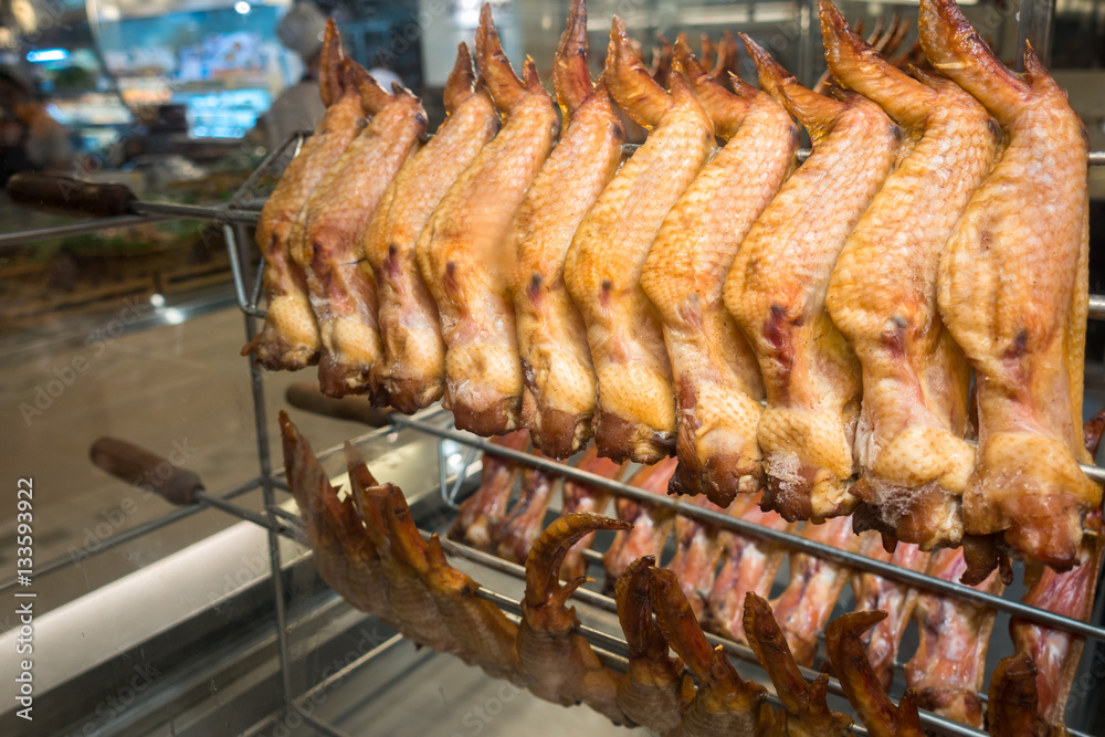 raw chicken wings on stainless stick rod for grill raw chicken wings on stainless stick rod for grill