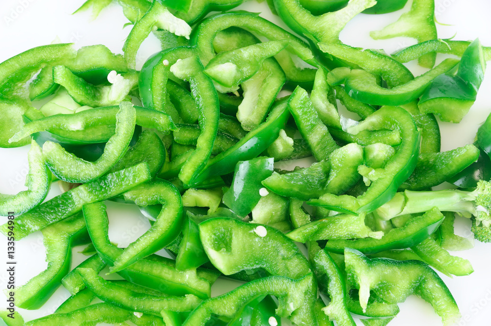 fresh chopped green pepper for salad isolated on white background fresh chopped green pepper for salad isolated on white background